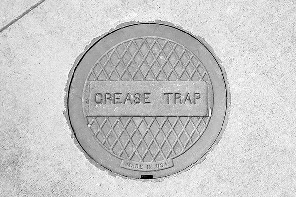 neglecting grease trap pumping can lead to sewer backups and fines for non-compliance
